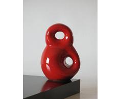 Escultura de barro rojo, hecha a mano en torno alfarero y modelada despues con diseño ocho descentrico. Esmaltada en rojo y disponible en varios colores y tres tamaños mas. Firmada y etiquetada por nuestro taller artesano. Medidas 14/11cm.